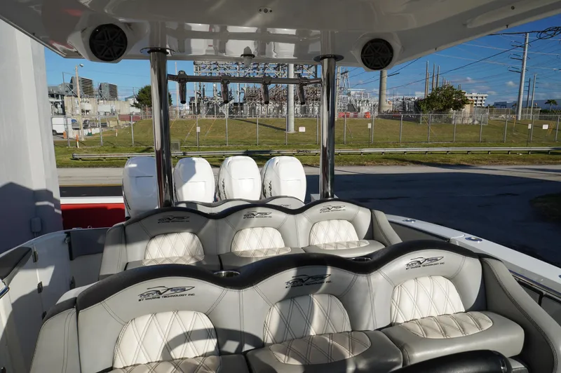  Yacht Photos Pics Interior of 2015 MTI 42 XSF boat with luxurious seating and outdoor view.