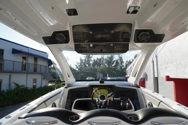  Yacht Photos Pics 2015 MTI 42 XSF boat interior with modern dashboard and speakers.