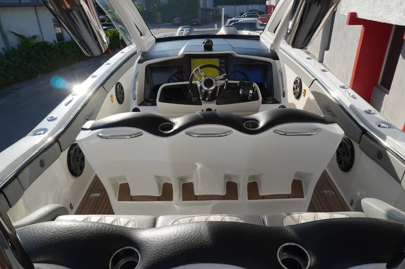  Yacht Photos Pics Interior view of 2015 MTI 42 XSF boat, featuring sleek seating and modern dashboard.