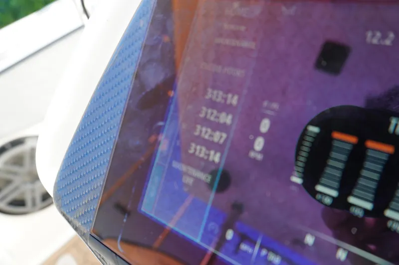  Yacht Photos Pics Close-up of 2015 MTI 42 XSF boat dashboard display with digital gauges.