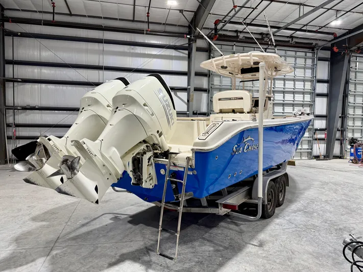  Yacht Photos Pics 2020 Sea Chaser 30 HFC CC boat with dual engines in a warehouse setting.