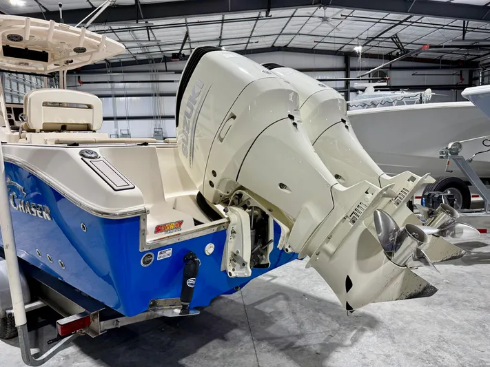  Yacht Photos Pics 2020 Sea Chaser 30 HFC CC boat with dual outboard engines in a warehouse setting.