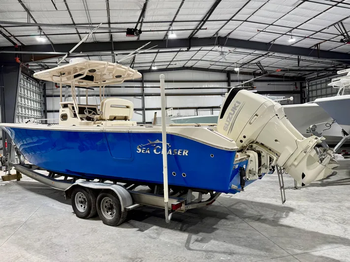  Yacht Photos Pics 2020 Sea Chaser 30 HFC CC boat in a warehouse, blue hull, on a trailer.