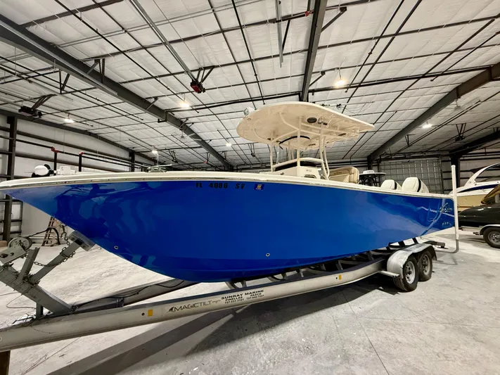  Yacht Photos Pics 2020 Sea Chaser 30 HFC CC boat on trailer in indoor storage facility.