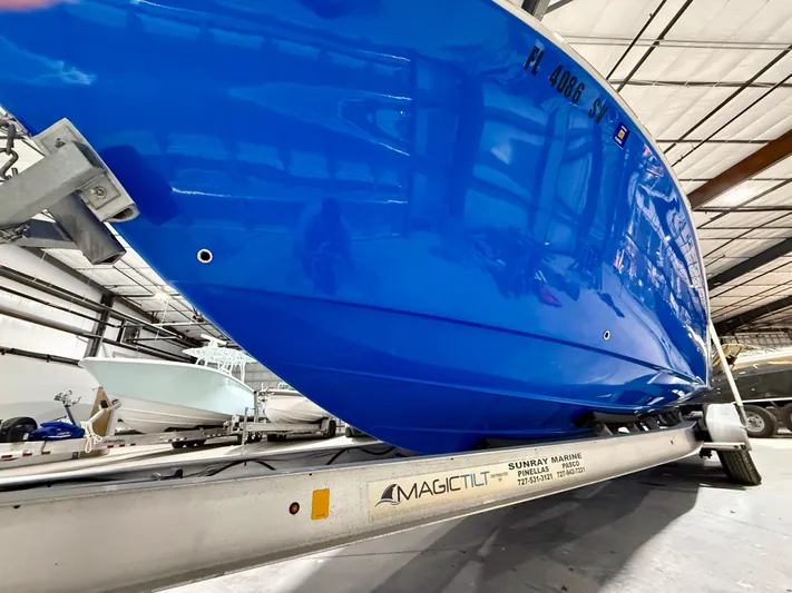  Yacht Photos Pics 2020 Sea Chaser 30 HFC CC boat on Magic Tilt trailer in warehouse.