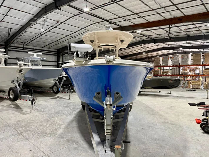  Yacht Photos Pics 2020 Sea Chaser 30 HFC CC boat in warehouse, front view, blue hull.