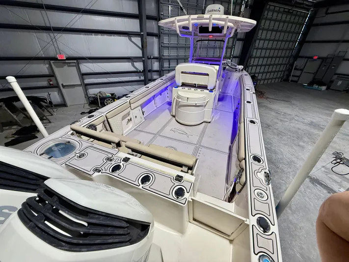  Yacht Photos Pics 2020 Sea Chaser 30 HFC CC boat in a warehouse, featuring blue interior lighting.
