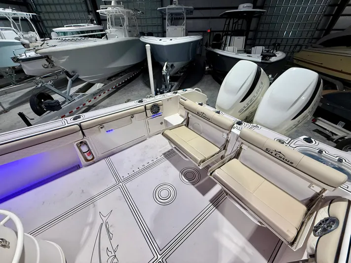  Yacht Photos Pics 2020 Sea Chaser 30 HFC CC boat interior with seating and dual engines in a showroom.