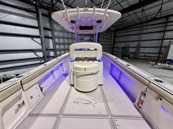  Yacht Photos Pics 2020 Sea Chaser 30 HFC CC boat interior with blue LED lighting in a warehouse.
