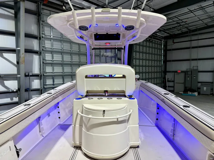  Yacht Photos Pics 2020 Sea Chaser 30 HFC CC boat interior with blue LED lighting in a warehouse.
