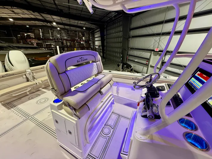  Yacht Photos Pics 2020 Sea Chaser 30 HFC CC boat interior with illuminated dashboard and seating.