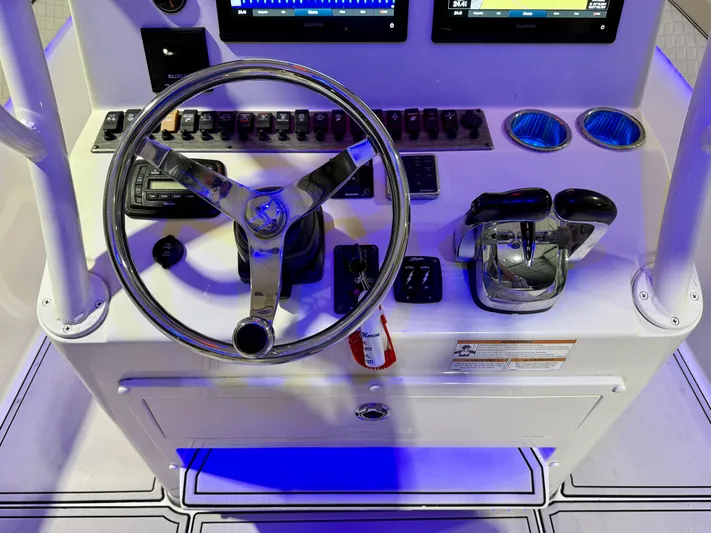  Yacht Photos Pics Control panel of 2020 Sea Chaser 30 HFC CC boat with steering wheel and throttle.