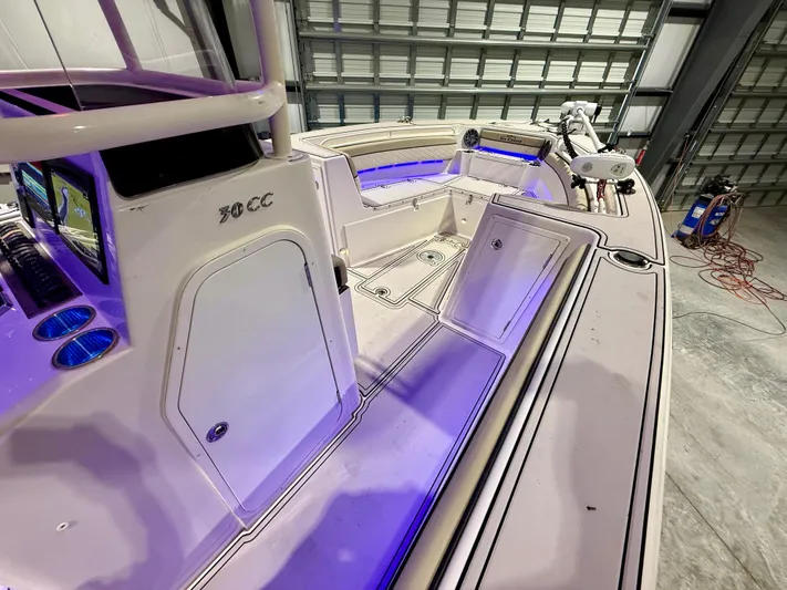  Yacht Photos Pics 2020 Sea Chaser 30 HFC CC boat interior with blue lighting in a garage.