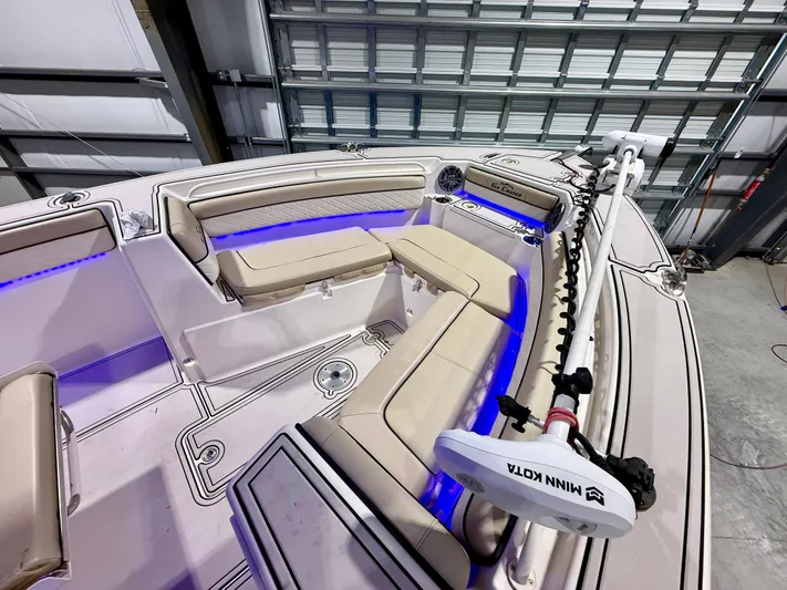  Yacht Photos Pics 2020 Sea Chaser 30 HFC CC boat interior with beige seating and blue LED lighting.