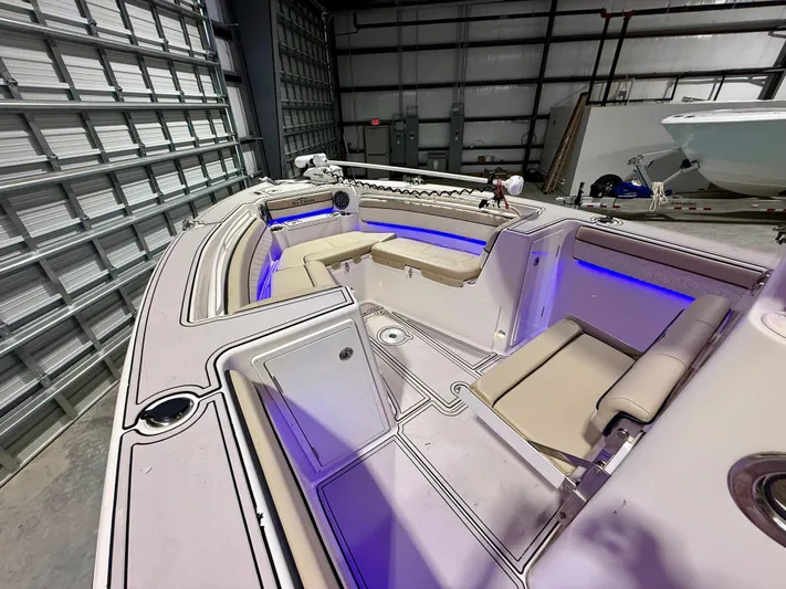  Yacht Photos Pics 2020 Sea Chaser 30 HFC CC boat interior with blue LED lighting in a storage facility.