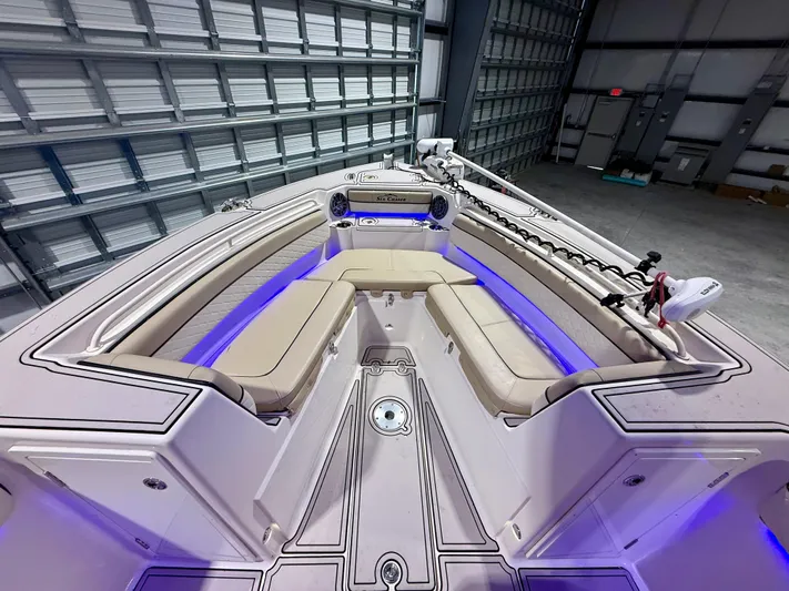  Yacht Photos Pics 2020 Sea Chaser 30 HFC CC boat interior with blue LED lighting and cushioned seating.