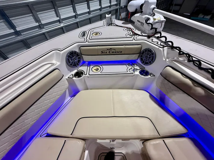  Yacht Photos Pics 2020 Sea Chaser 30 HFC CC boat interior with blue LED lighting and cushioned seating.