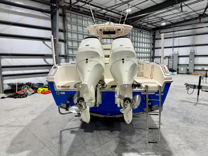  Yacht Photos Pics 2020 Sea Chaser 30 HFC CC boat with dual outboard engines in a warehouse.