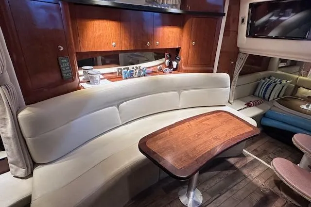  Yacht Photos Pics Interior of 2007 Sea Ray 340 Sundancer yacht with elegant seating and wooden table.