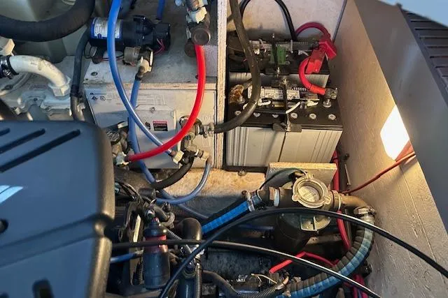  Yacht Photos Pics Engine compartment of a 2007 Sea Ray 340 Sundancer with visible battery and wiring.