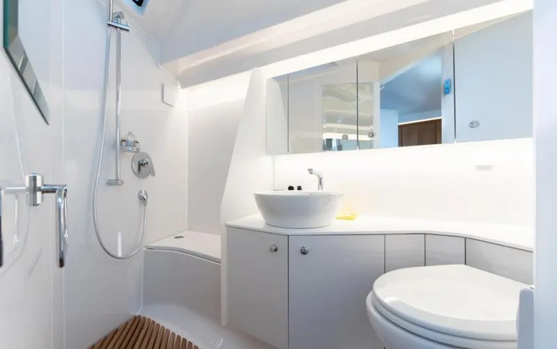  Yacht Photos Pics Luxurious bathroom interior of 2019 Frauscher 1414 Demon yacht, featuring modern fixtures and sleek design.