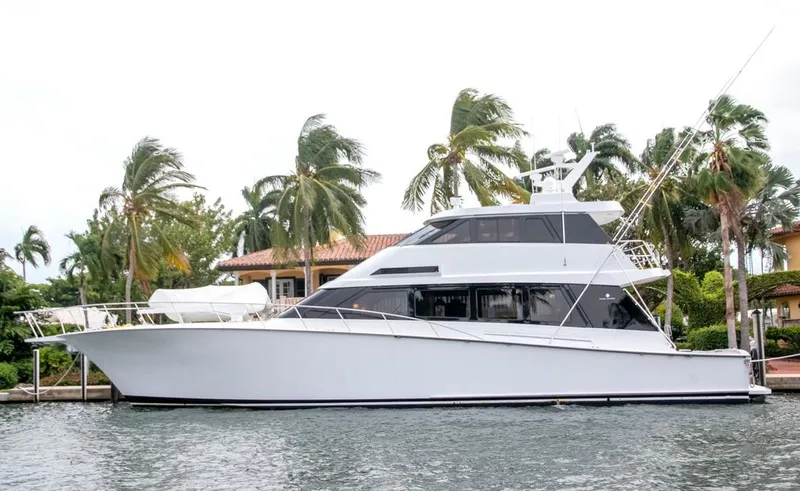 Chairman Yacht Photos Pics 1997 Palmer Johnson 80 Sportfish M/Y yacht docked by palm trees.