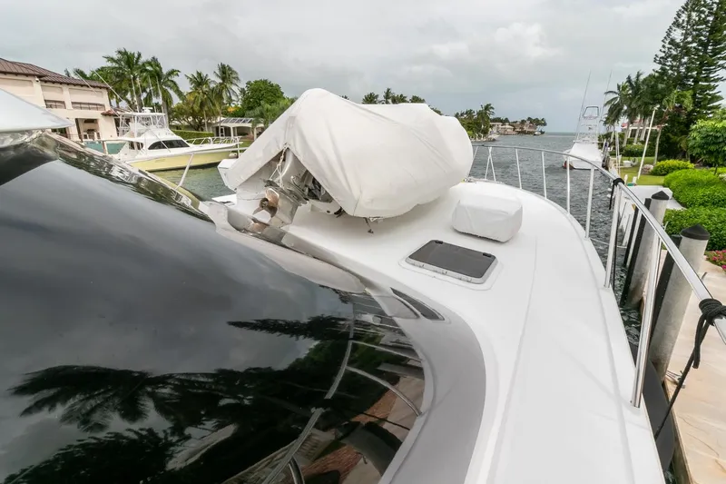 Chairman Yacht Photos Pics 1997 Palmer Johnson 80 Sportfish M/Y yacht docked by waterfront homes.