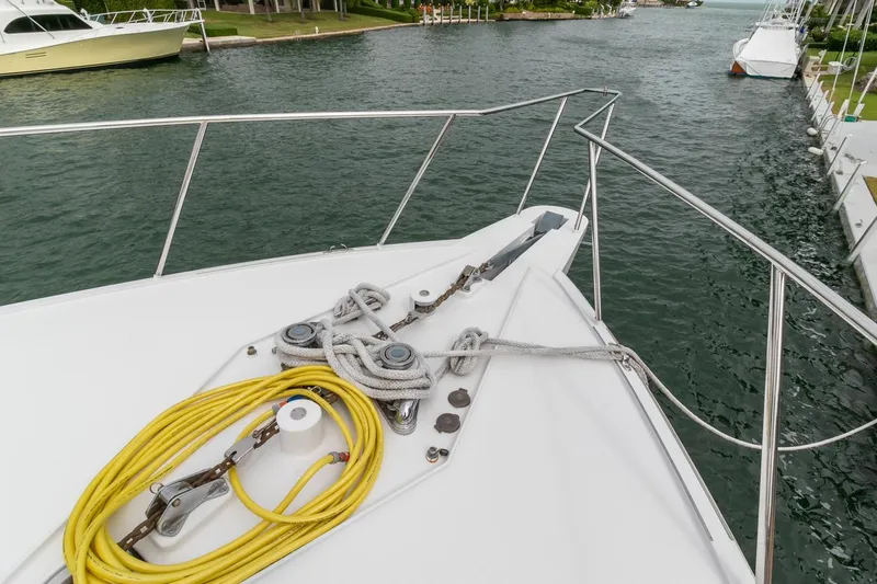 Chairman Yacht Photos Pics Palmer Johnson 80 Sportfish M/Y 1997 yacht bow with ropes and waterway view.