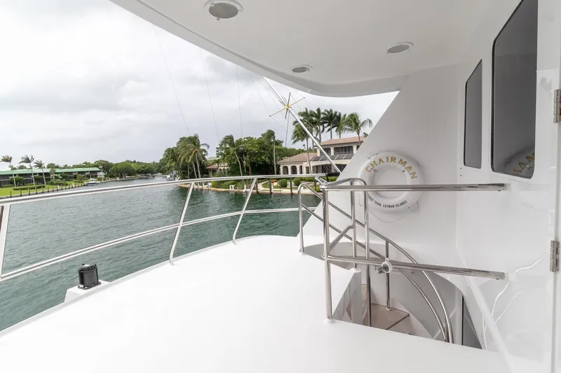 Chairman Yacht Photos Pics Palmer Johnson 80 Sportfish M/Y 1997 yacht deck with railing and waterfront view.