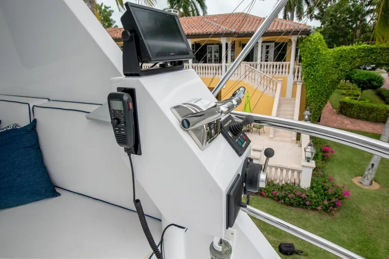 Chairman Yacht Photos Pics Control panel of 1997 Palmer Johnson 80 Sportfish yacht with lush garden view.