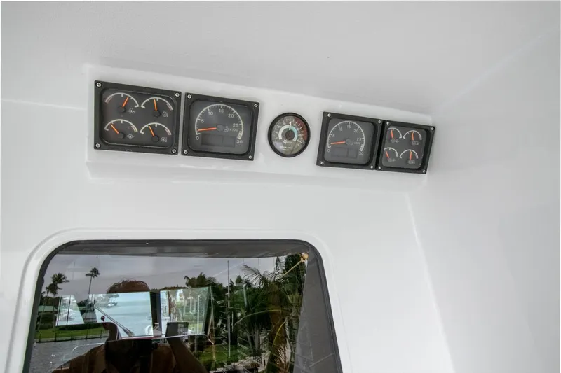 Chairman Yacht Photos Pics Control panel of 1997 Palmer Johnson 80 Sportfish M/Y with gauges and compass.