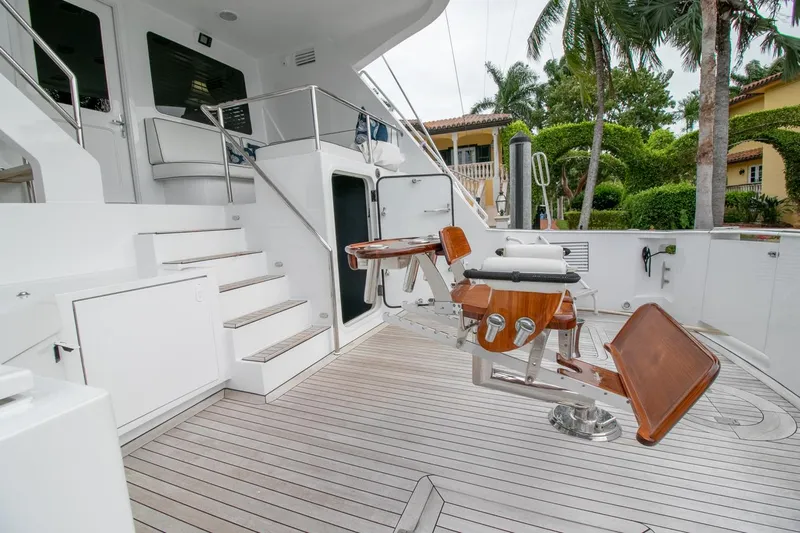 Chairman Yacht Photos Pics Palmer Johnson 80 Sportfish M/Y 1997 yacht deck with fishing chair and stairs.