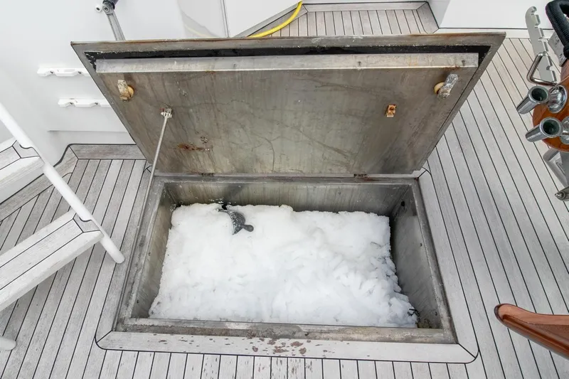 Chairman Yacht Photos Pics Open ice storage compartment on 1997 Palmer Johnson 80 Sportfish yacht deck.