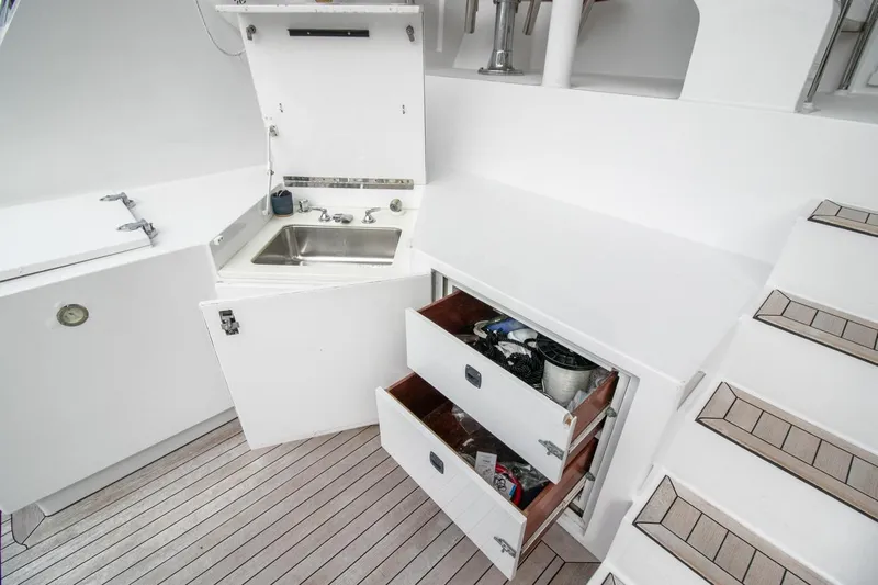 Chairman Yacht Photos Pics Palmer Johnson 80 Sportfish M/Y 1997 yacht interior with sink and storage drawers.