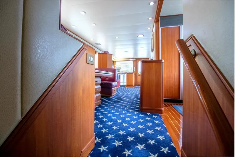 Chairman Yacht Photos Pics Luxurious interior of 1997 Palmer Johnson 80 Sportfish yacht with star-patterned carpet.