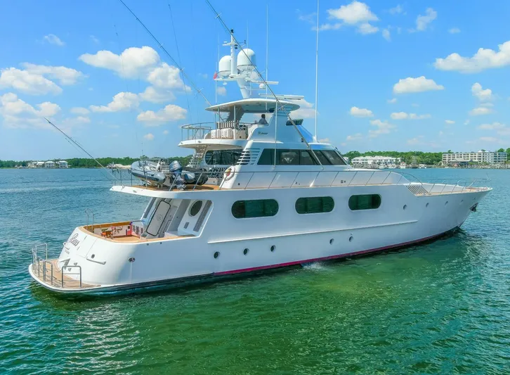 Boss Yacht Photos Pics 1989 Feadship 116 Sport Fisher yacht on calm water under blue sky.