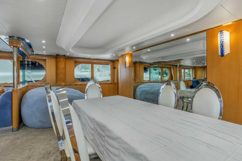 Boss Yacht Photos Pics Luxurious interior of 1989 Feadship 116 Sport Fisher yacht with elegant dining area.