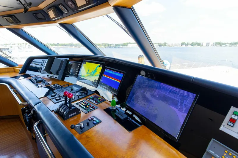 Boss Yacht Photos Pics Control panel of 1989 Feadship 116 Sport Fisher yacht with navigation screens.