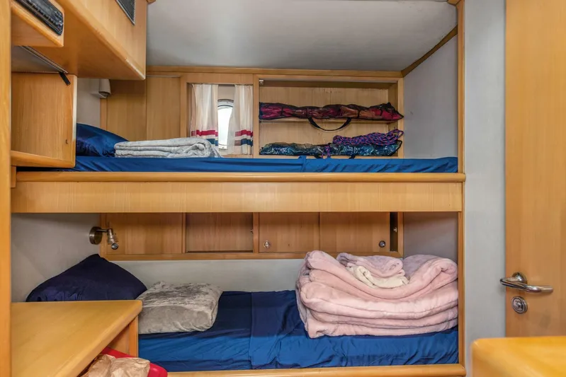 Boss Yacht Photos Pics Cozy bunk beds in 1989 Feadship 116 Sport Fisher yacht cabin.