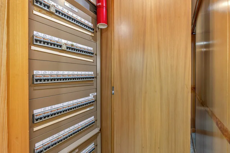 Boss Yacht Photos Pics Electrical panel inside 1989 Feadship 116 Sport Fisher yacht, wooden interior.