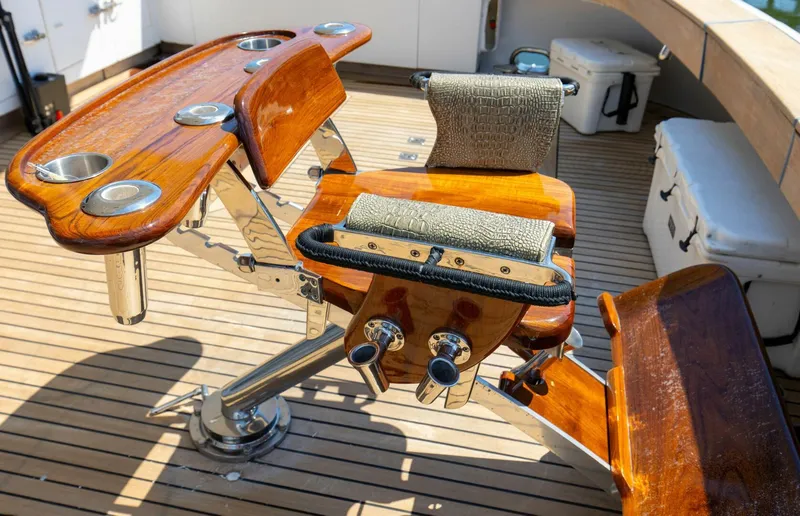Boss Yacht Photos Pics Luxurious teak fishing chair on 1989 Feadship 116 Sport Fisher yacht deck.