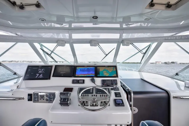 Reel Blessed Yacht Photos Pics Helm of 2006 Cabo 52 Open yacht with advanced navigation displays and controls.