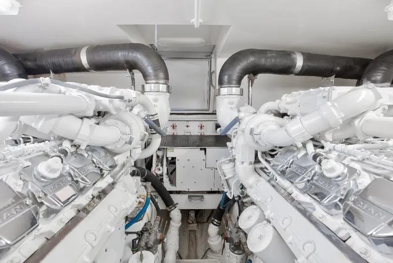 Reel Blessed Yacht Photos Pics Engine room of 2006 Cabo 52 Open yacht, featuring dual MAN engines.