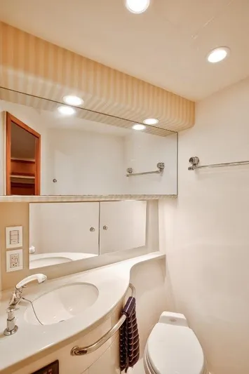 Reel Blessed Yacht Photos Pics Luxurious bathroom in 2006 Cabo 52 Open yacht with modern fixtures and elegant design.