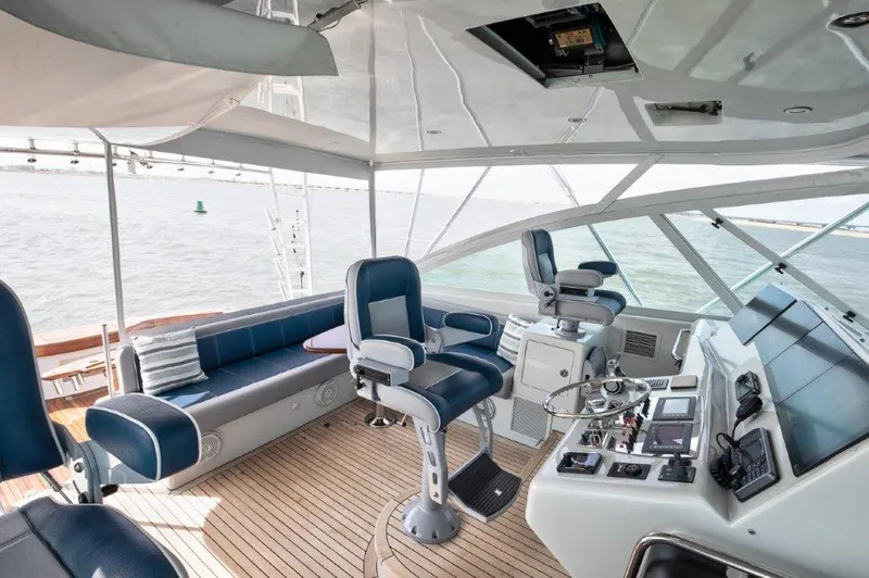 Reel Blessed Yacht Photos Pics Luxurious 2006 Cabo 52 Open yacht interior with helm, seating, and ocean view.