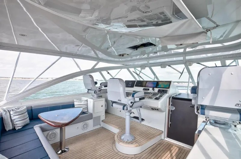 Reel Blessed Yacht Photos Pics Luxurious 2006 Cabo 52 Open yacht interior with helm, seating, and navigation equipment.