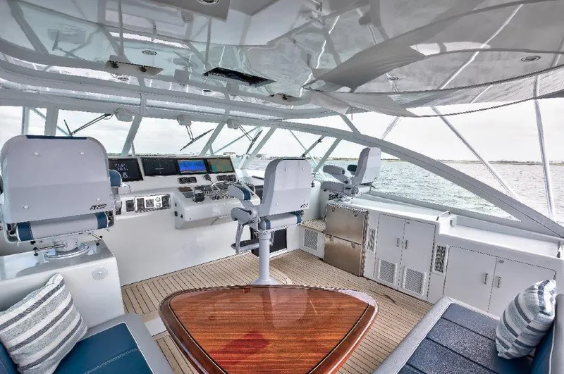 Reel Blessed Yacht Photos Pics Luxurious 2006 Cabo 52 Open yacht interior with helm, seating, and ocean view.