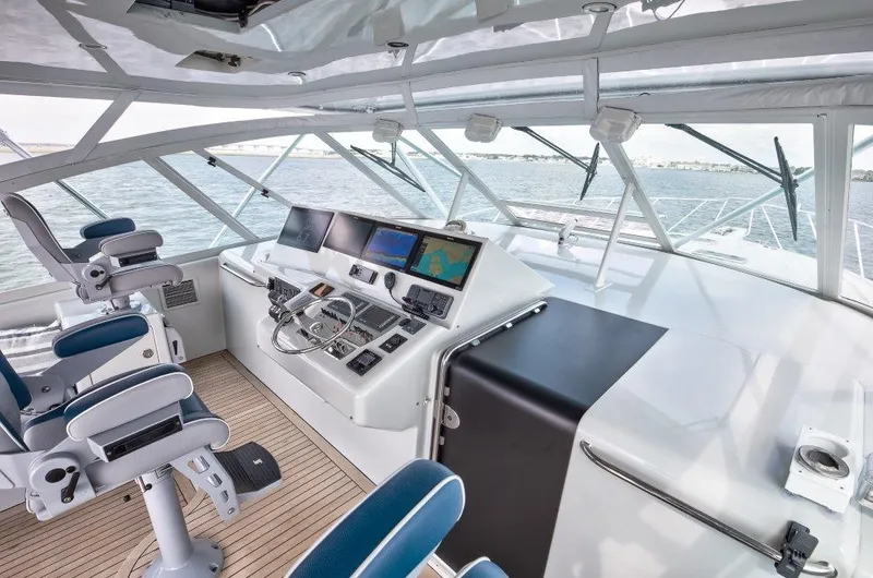 Reel Blessed Yacht Photos Pics Interior view of 2006 Cabo 52 Open yacht cockpit with navigation equipment.