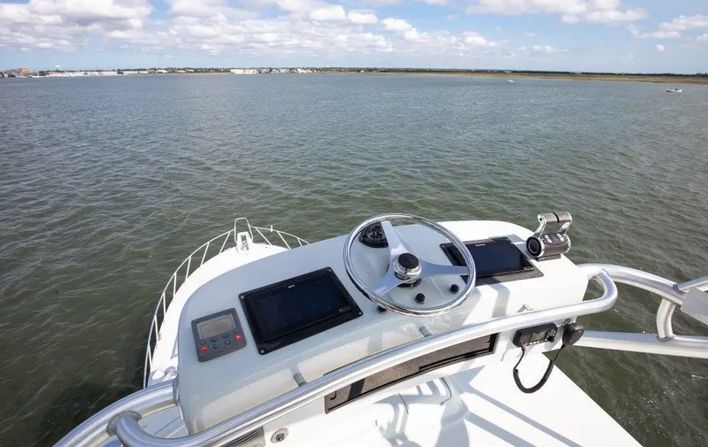 Reel Blessed Yacht Photos Pics 2006 Cabo 52 Open yacht helm with ocean view and navigation equipment.