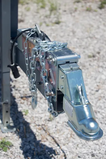  Yacht Photos Pics Trailer hitch with chain lock on gravel, Contender 39 LS, 2012 model.